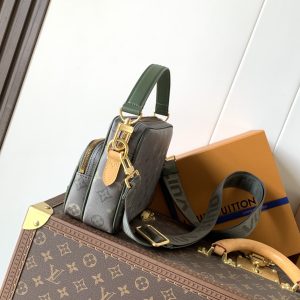 Alternative view of • Monogram Heritage coated canvas • Calf leather trim • Fabric lining • Metal hardware • Zipper closure • Zippered front pocket • Main compartment • Interior patch pocket • Shoulder strap: Detachable, adjustable • Strap half-length: 49.0 cm • Strap half-length adjustable to: 59.0 cm • Handle: Single handle, detachable